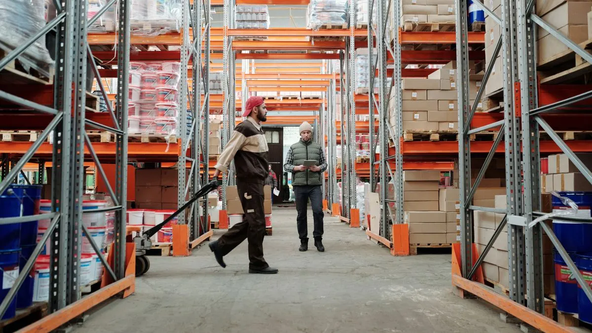 Warehouse workers managing inventory, jobs that often pay Alberta minimum wage