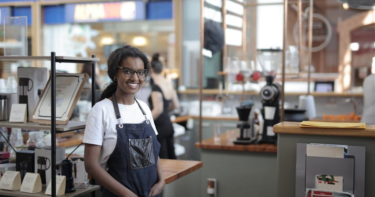 Small business owner in a shop representing business loans in Canada