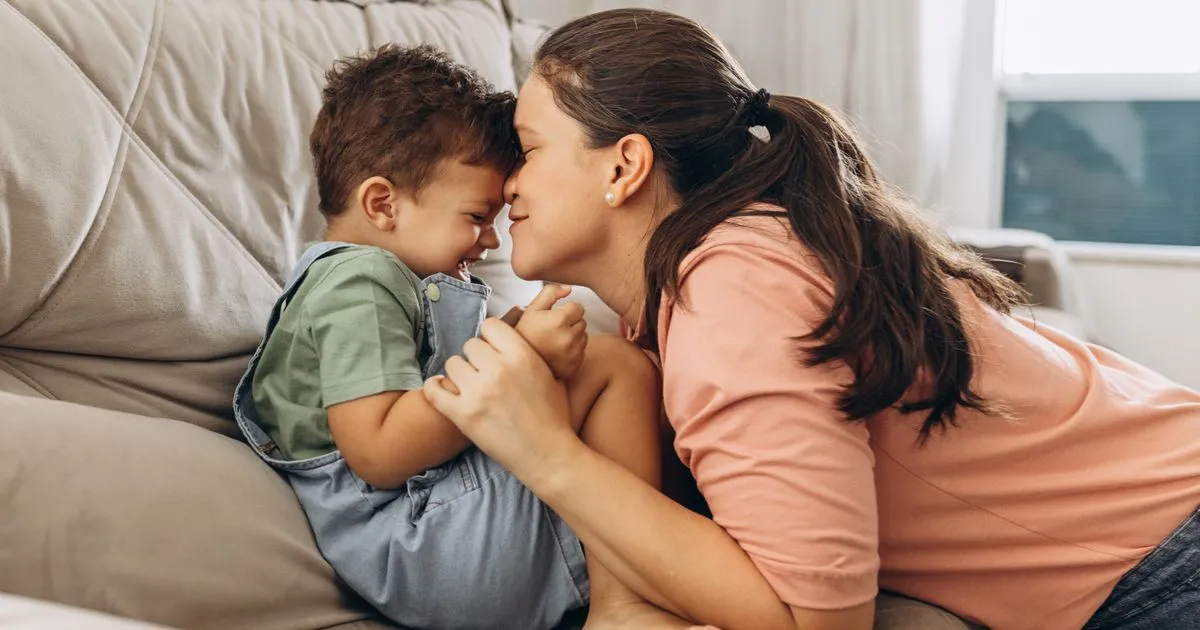 Parent and child at home, a family that receives Canada Child Benefit payments