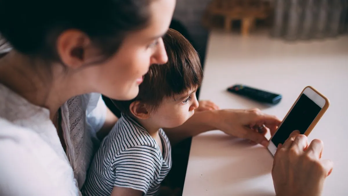 Parent checking a CCB payment on a phone
