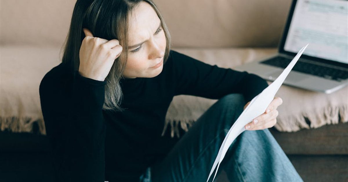 Person reviewing finances while considering a bad credit loan in Canada