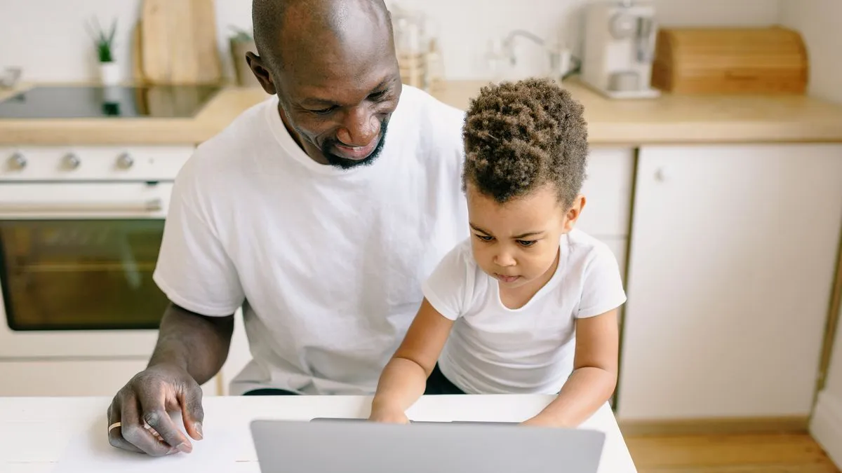 Parent applying for the Canada Child Benefit online at home