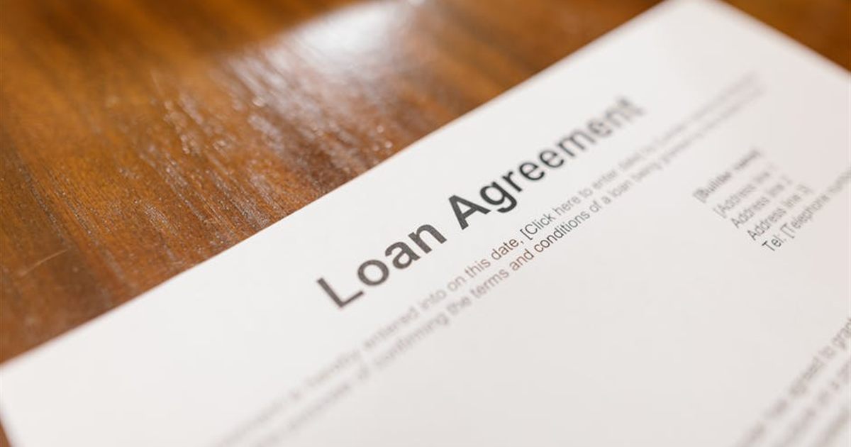 Loan agreement document on a desk representing online personal loans in Canada