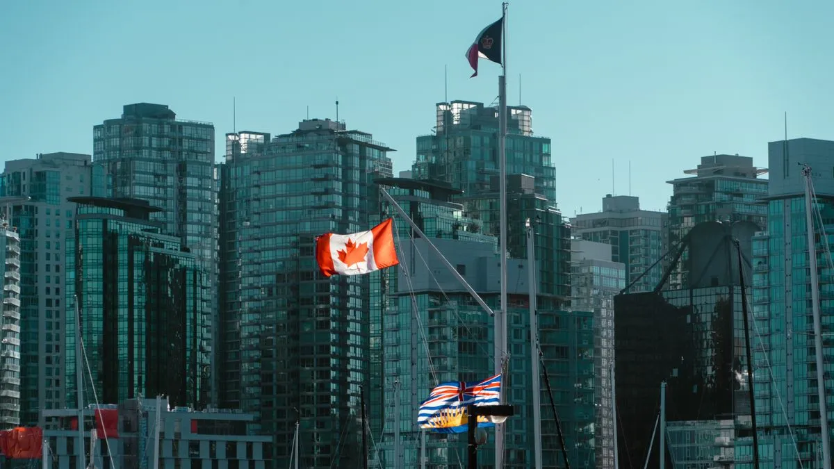 Canadian flags over Vancouver, home of our personal finance guides Canada-wide