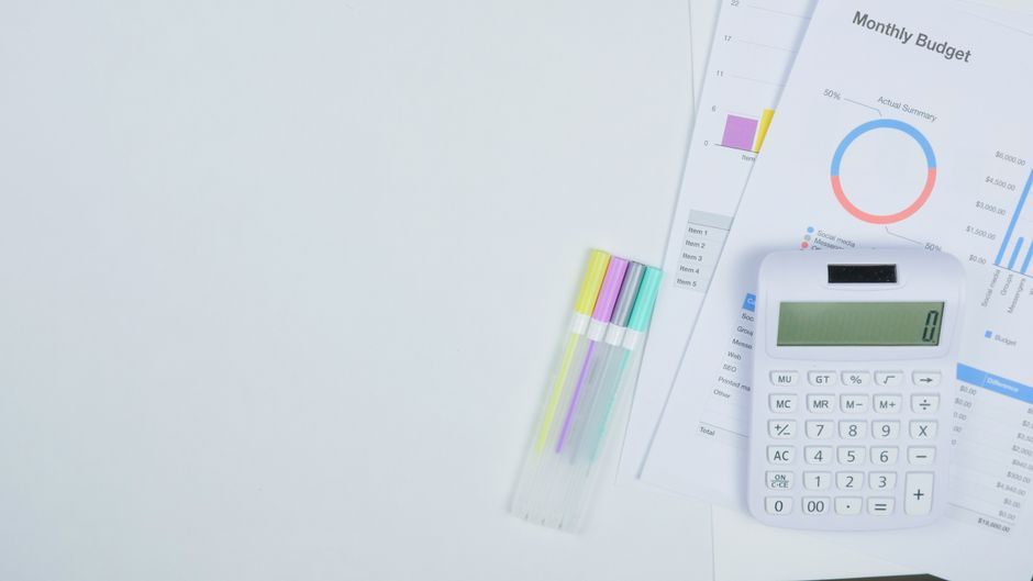 Calculator and budget chart used to compare personal loan rates in Canada