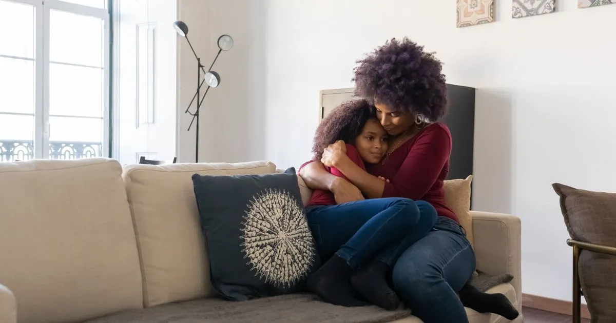 Single mother and daughter at home in Canada, family supported by single parent benefits