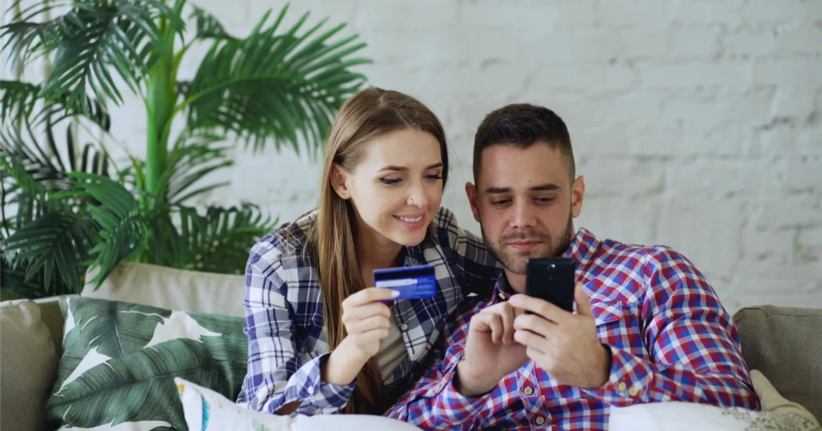 CPC SCP charge check: couple reviewing a credit card statement on a phone