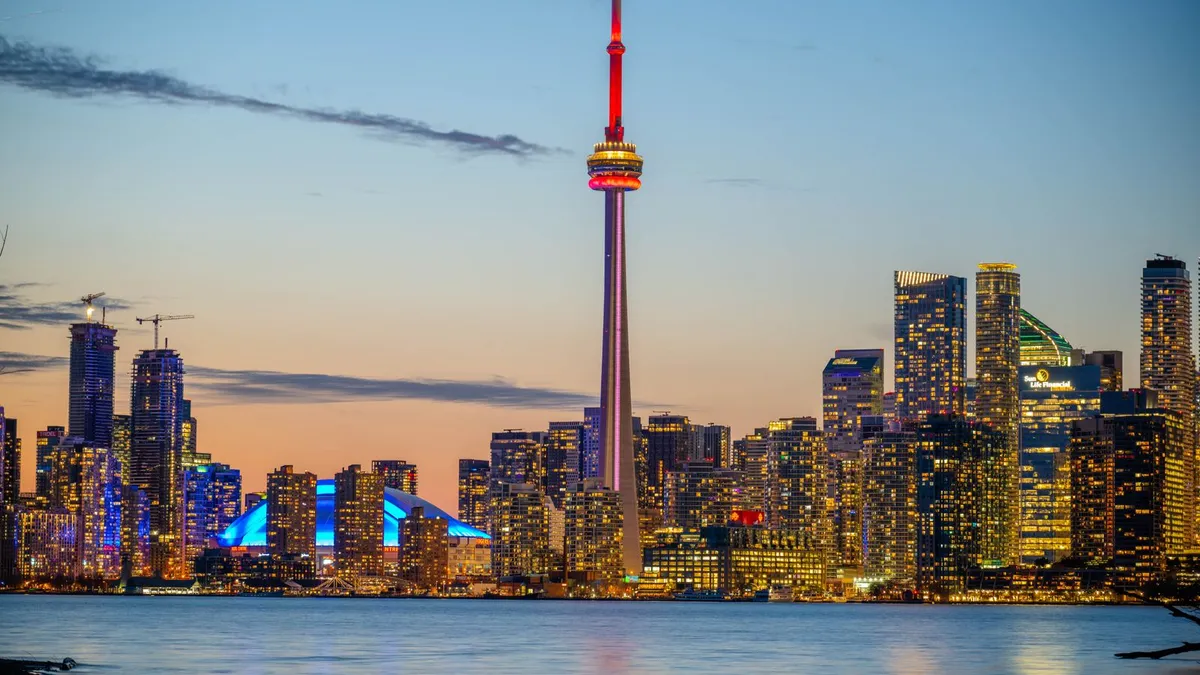 Toronto skyline at dusk; consumer proposal rules are federal, so the consumer proposal disadvantages are the same in every province
